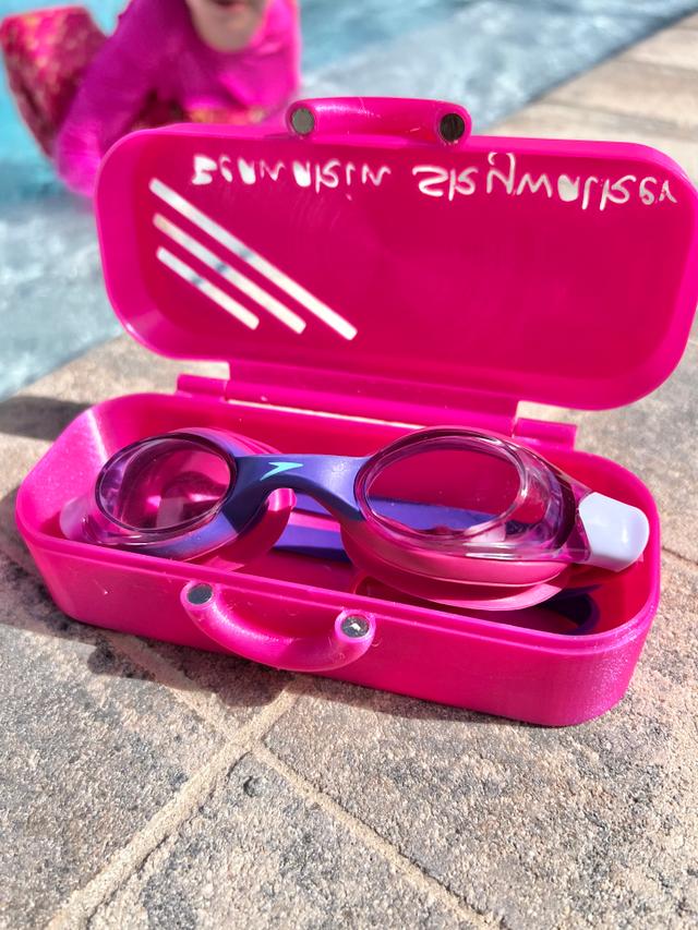 My daughter requested a "custom" goggle holder... with next to zero cad ability, it was off to MakerWorld, where I found: https://makerworld.com/en/models/1980796-swimming-goggles-holder#profileId-2130683
I opted to print in TPU, just for the hope it would stand up to the weather, and a six year old who takes after her dad (clumsy). I added some magnets to keep it locked (since it was now in TPU). It turned out great, and my daughter loved it. Thanks to Vincent @white1073 for the model upload. The smooth plate with a design on it, really made the Pixie Dust TPU pop... Special thank you to Megan at Cookiecad. Amazingly fast customer service and so helpful!